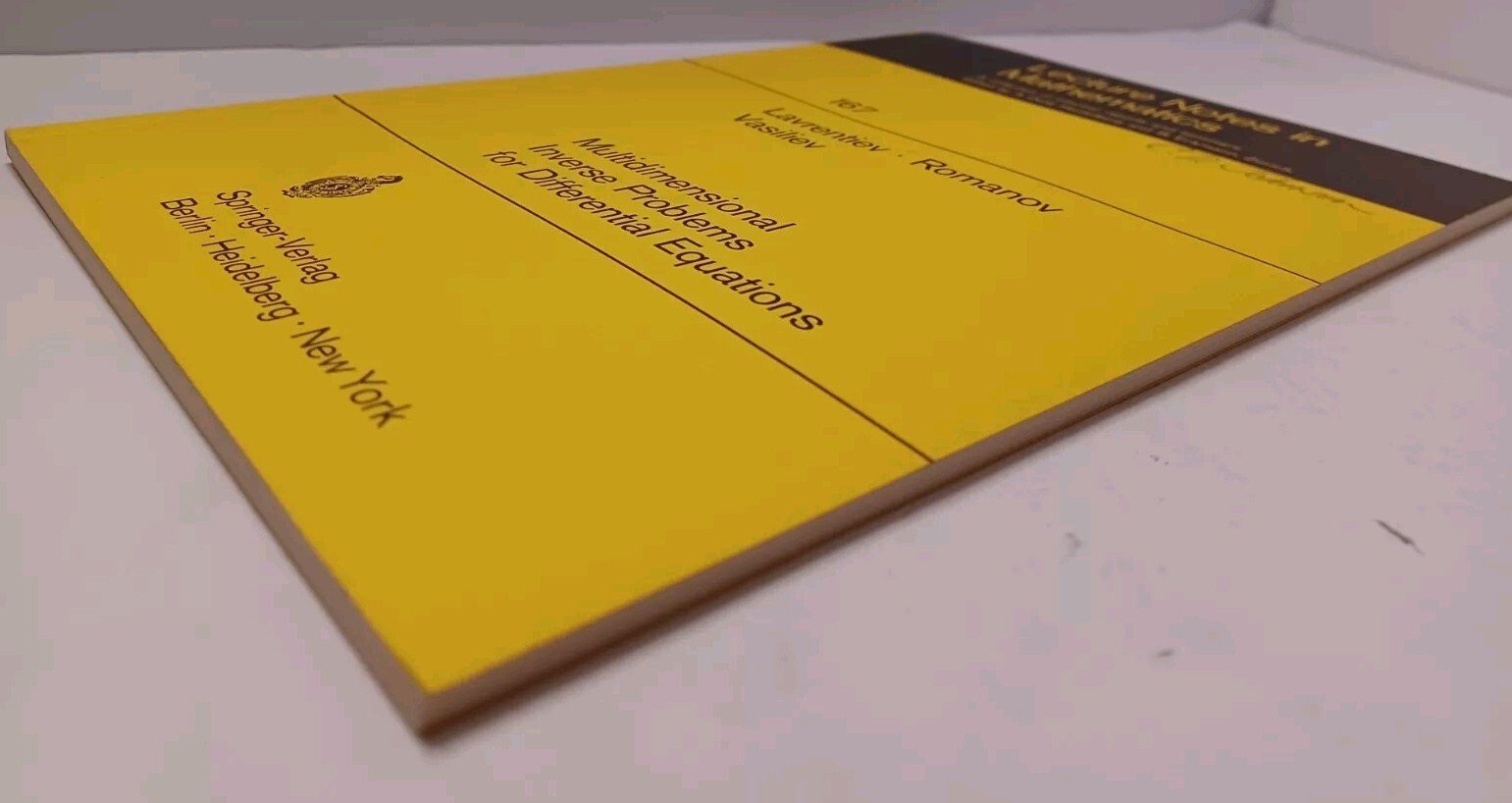 Multidimensional Inverse Problems for Differential Equations – Lavrentiev
